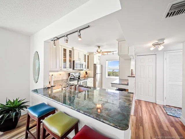 a view of a living room and dining room