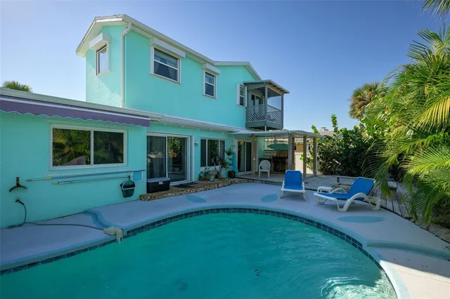 a living room with a large bed and a large window