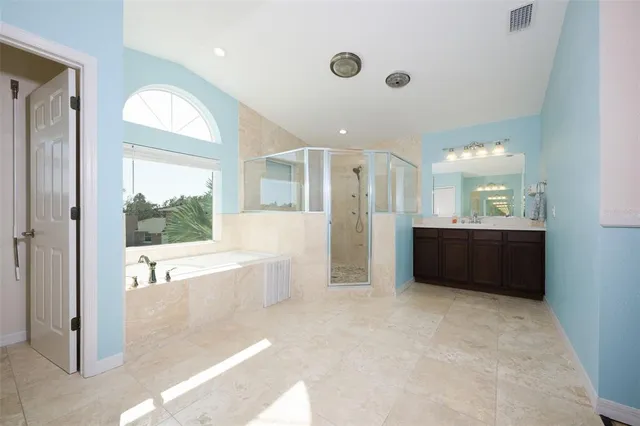 a view of empty room with ceiling fan