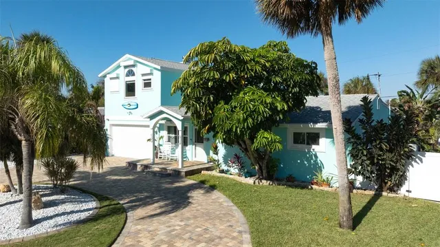 a view of a swimming pool in a backyard