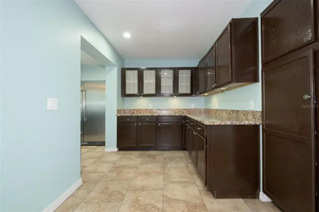 a kitchen with a stove and a refrigerator