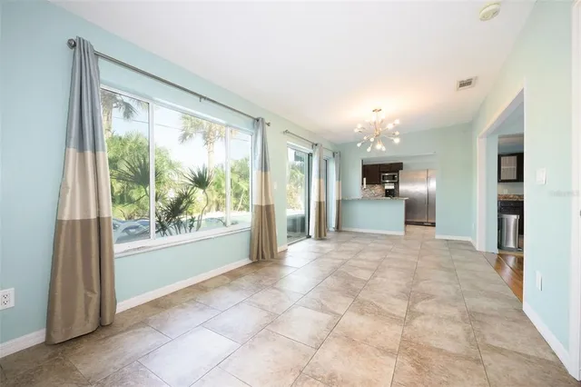 a view of a kitchen with furniture and a large window