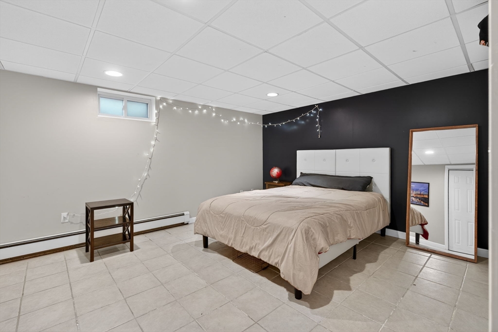 17 Karlton Circle Andover, MA 01810 - Photo 16 of 18 a bedroom with a bed and a lamp on desk