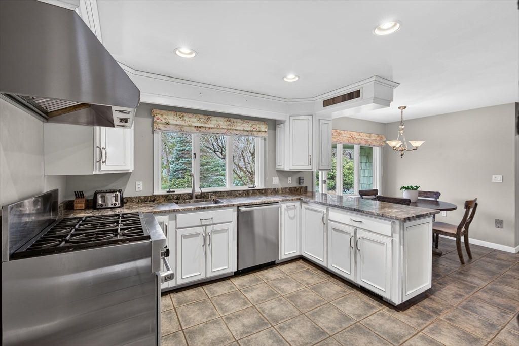 17 Karlton Circle Andover, MA 01810 - Photo 7 of 18 a kitchen with a sink stove and cabinets