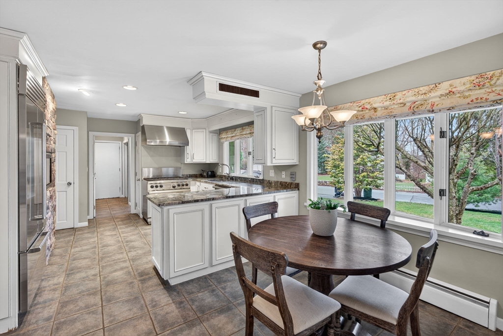 17 Karlton Circle Andover, MA 01810 - Photo 8 of 18 a kitchen with a table and chairs in it