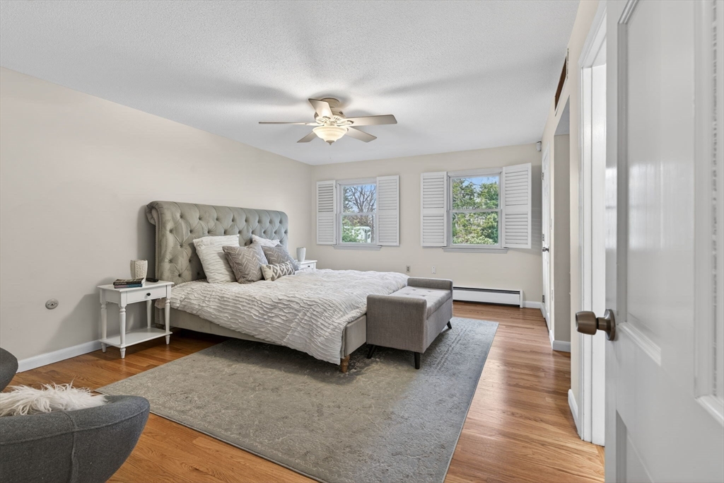 17 Karlton Circle Andover, MA 01810 - Photo 10 of 18 a spacious bedroom with a bed couch and a window
