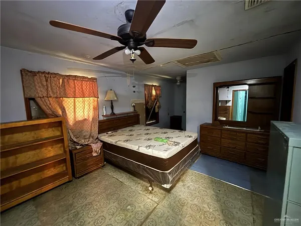 a living room with kitchen furniture and a window