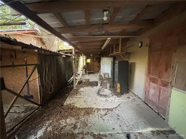 a view of a chairs and table in backyard