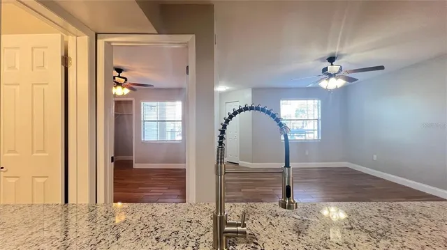 a view of a hallway with entryway window and front door