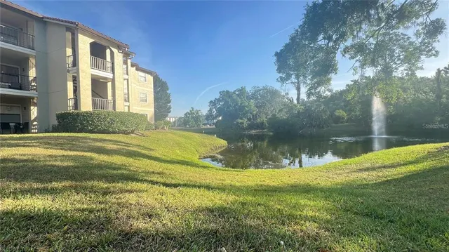 a view of a lake with a house in the background