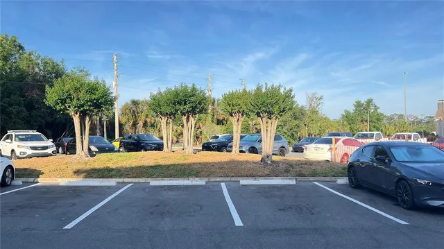 a view of a street with of cars parked