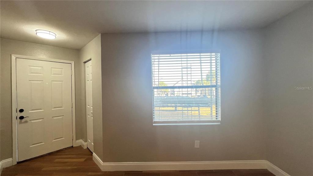 3038 Parkway Boulevard, Unit 204 Kissimmee, FL 34747 - Photo 10 of 31 a view of small space with wooden floor and a window