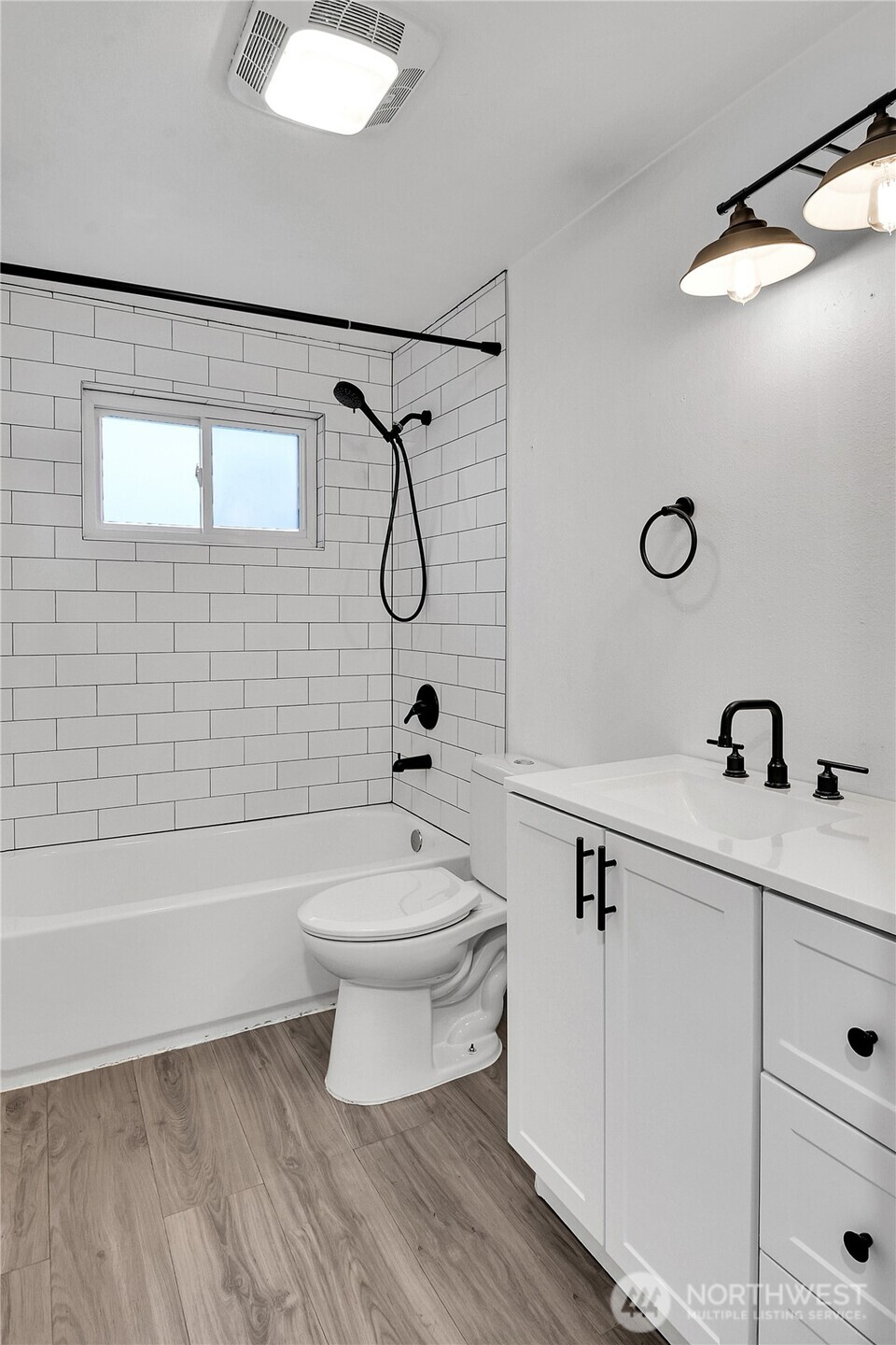 15771 119th Place Southeast Renton, WA 98058 - Photo 11 of 20 a bathroom with a sink a toilet and shower