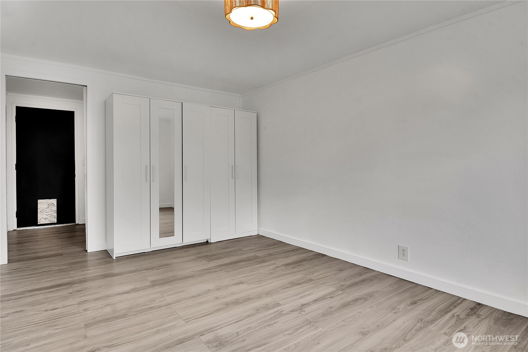 15771 119th Place Southeast Renton, WA 98058 - Photo 14 of 20 a view of an empty room with wooden floor