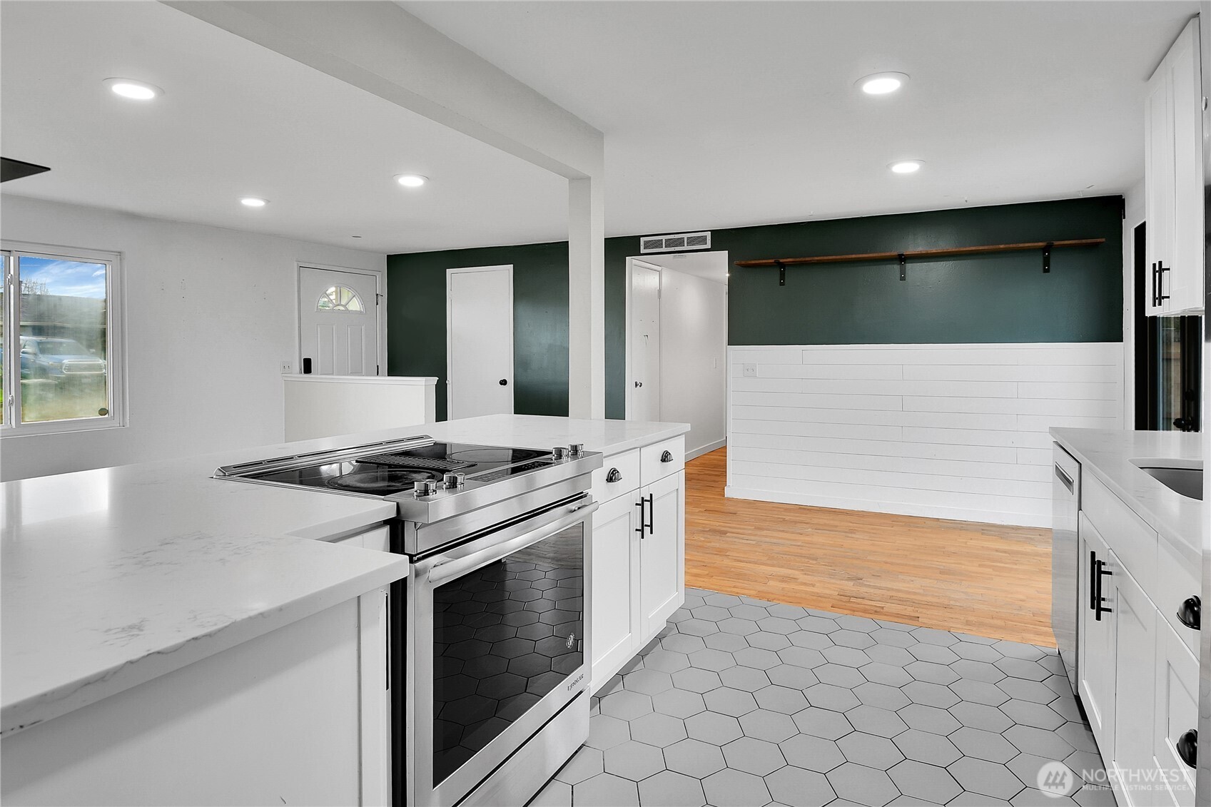 15771 119th Place Southeast Renton, WA 98058 - Photo 8 of 20 a kitchen with stainless steel appliances granite countertop a stove and a refrigerator