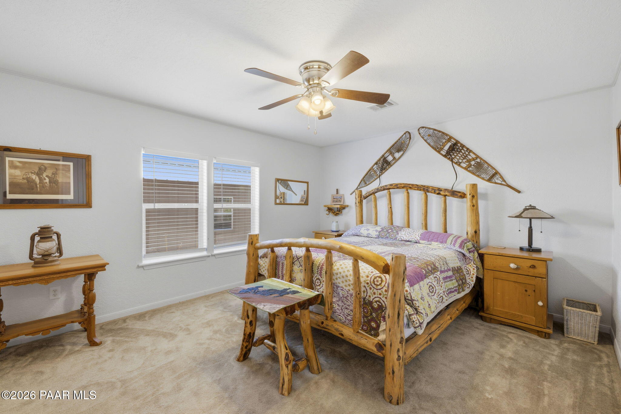 875 West Little Ranch Road Paulden, AZ 86334 - Photo 16 of 51 a bed sitting in a bedroom next to a window