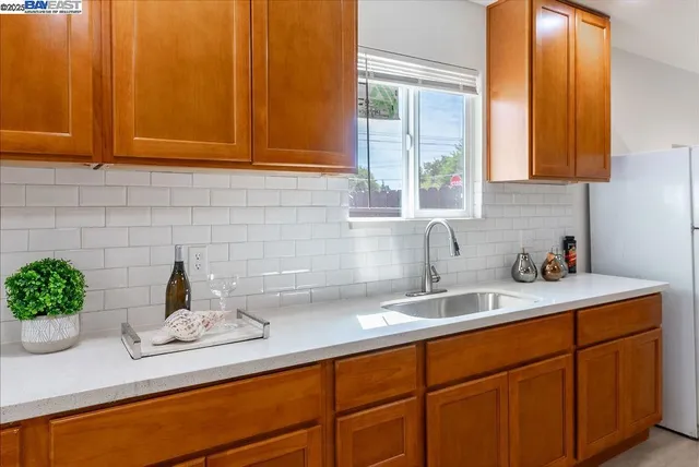 a kitchen with a sink and a window