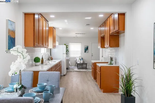 a view of a dining room with furniture and wooden floor