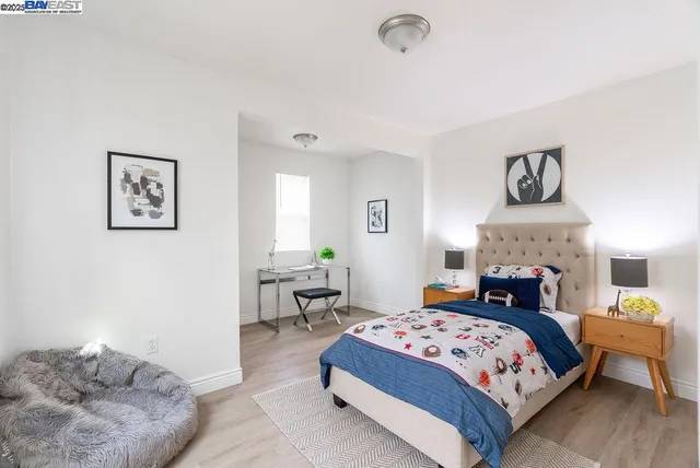 a bedroom with a bed and window