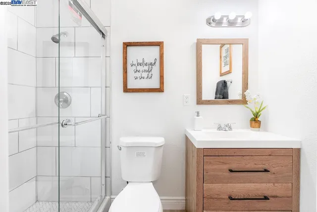 a view of small space with wooden floor and windows