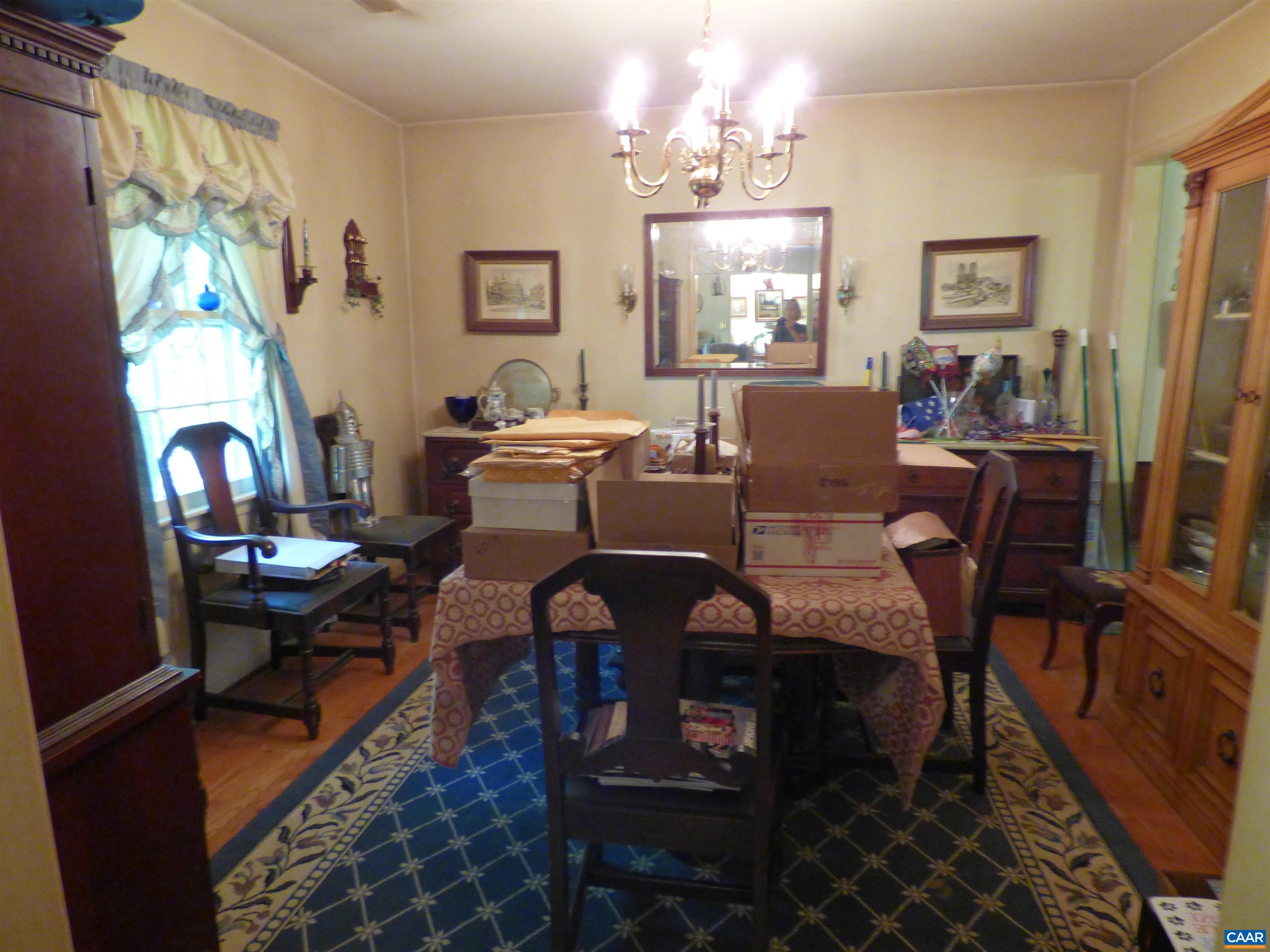 282 Kenmore Road Amherst, VA 24521 - Photo 11 of 33 a view of a dining room with furniture and a chandelier