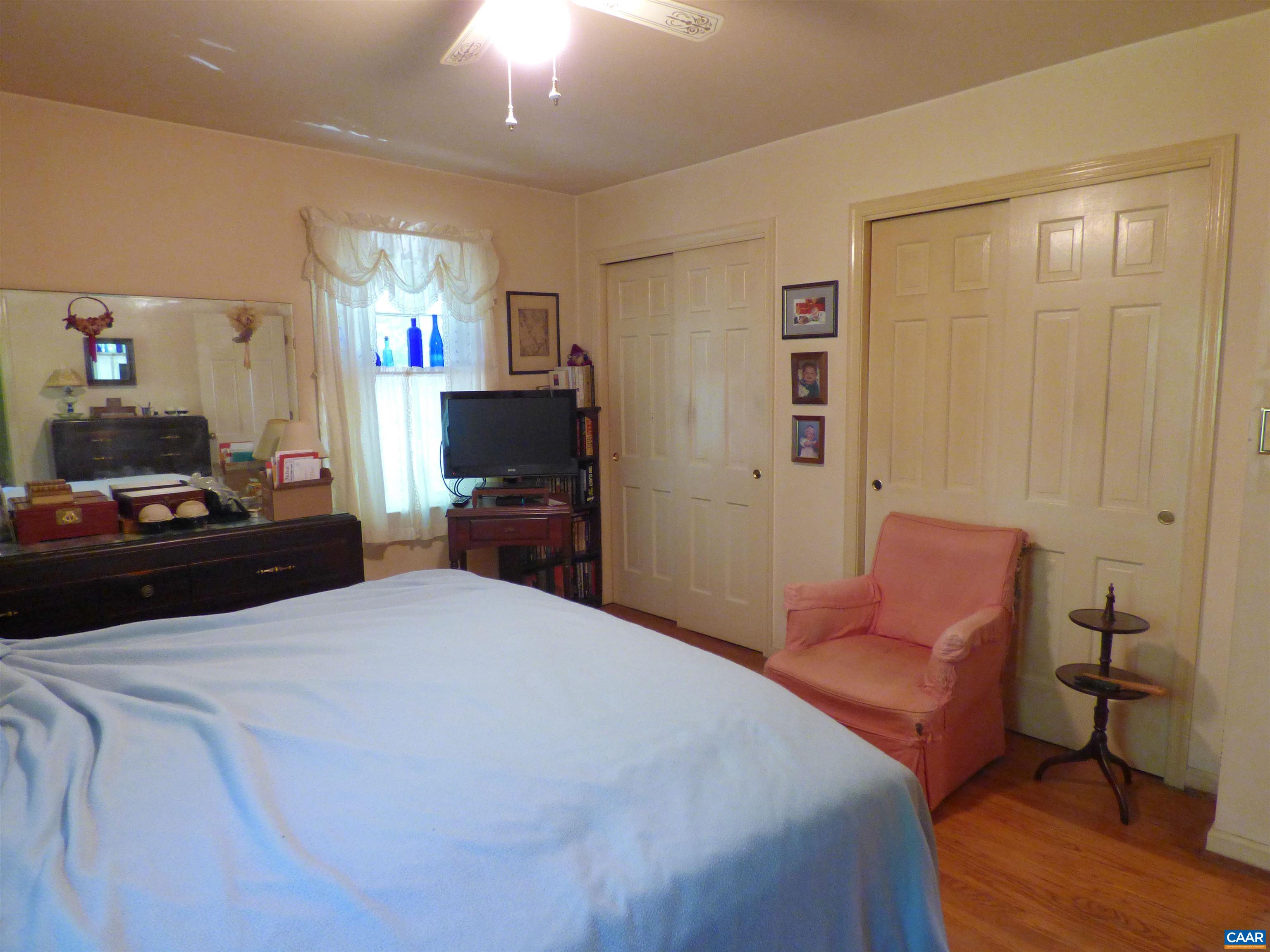 282 Kenmore Road Amherst, VA 24521 - Photo 15 of 33 a bedroom with a bed and wooden floor