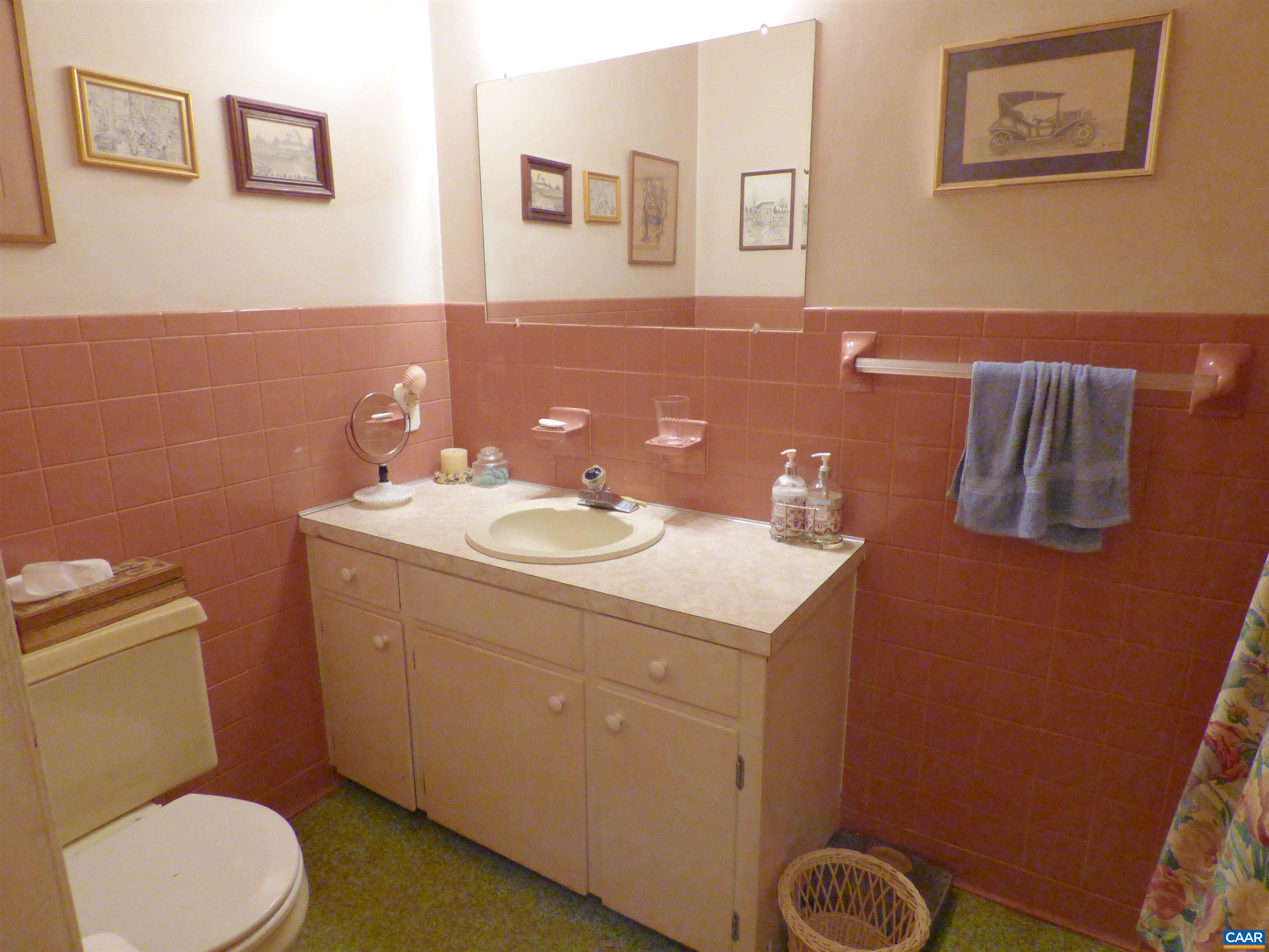 282 Kenmore Road Amherst, VA 24521 - Photo 17 of 33 a bathroom with a sink mirror vanity and toilet