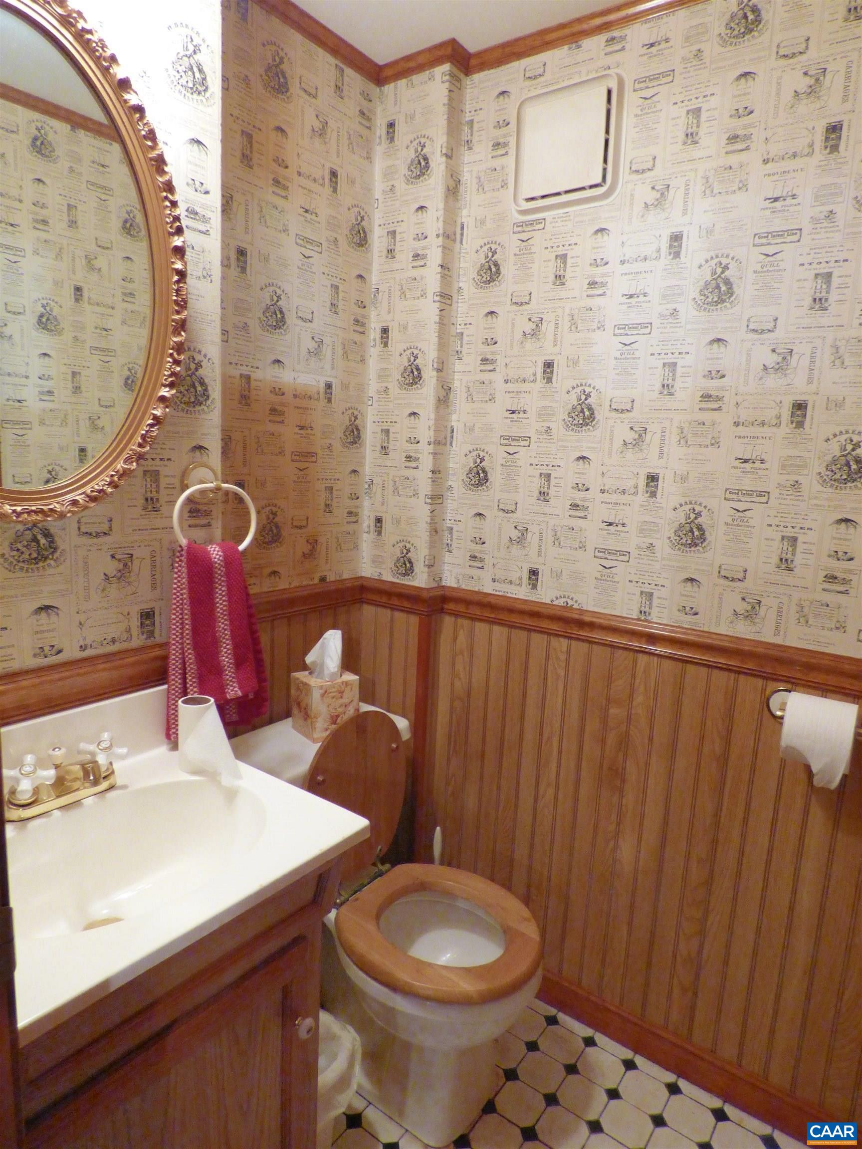 282 Kenmore Road Amherst, VA 24521 - Photo 22 of 33 a bathroom with a sink a toilet and a mirror