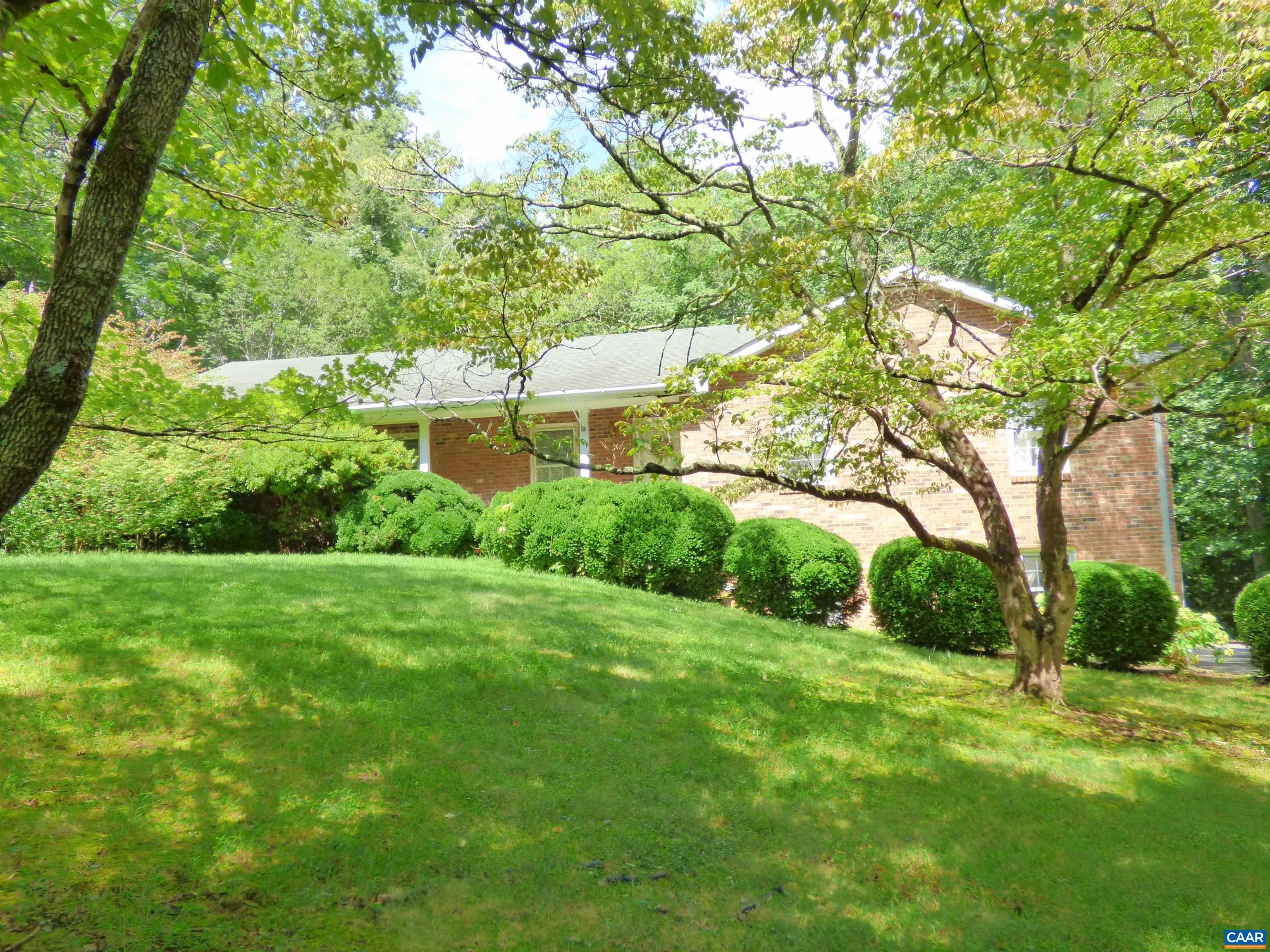 282 Kenmore Road Amherst, VA 24521 - Photo 33 of 33 a view of a big yard with plants and a large tree