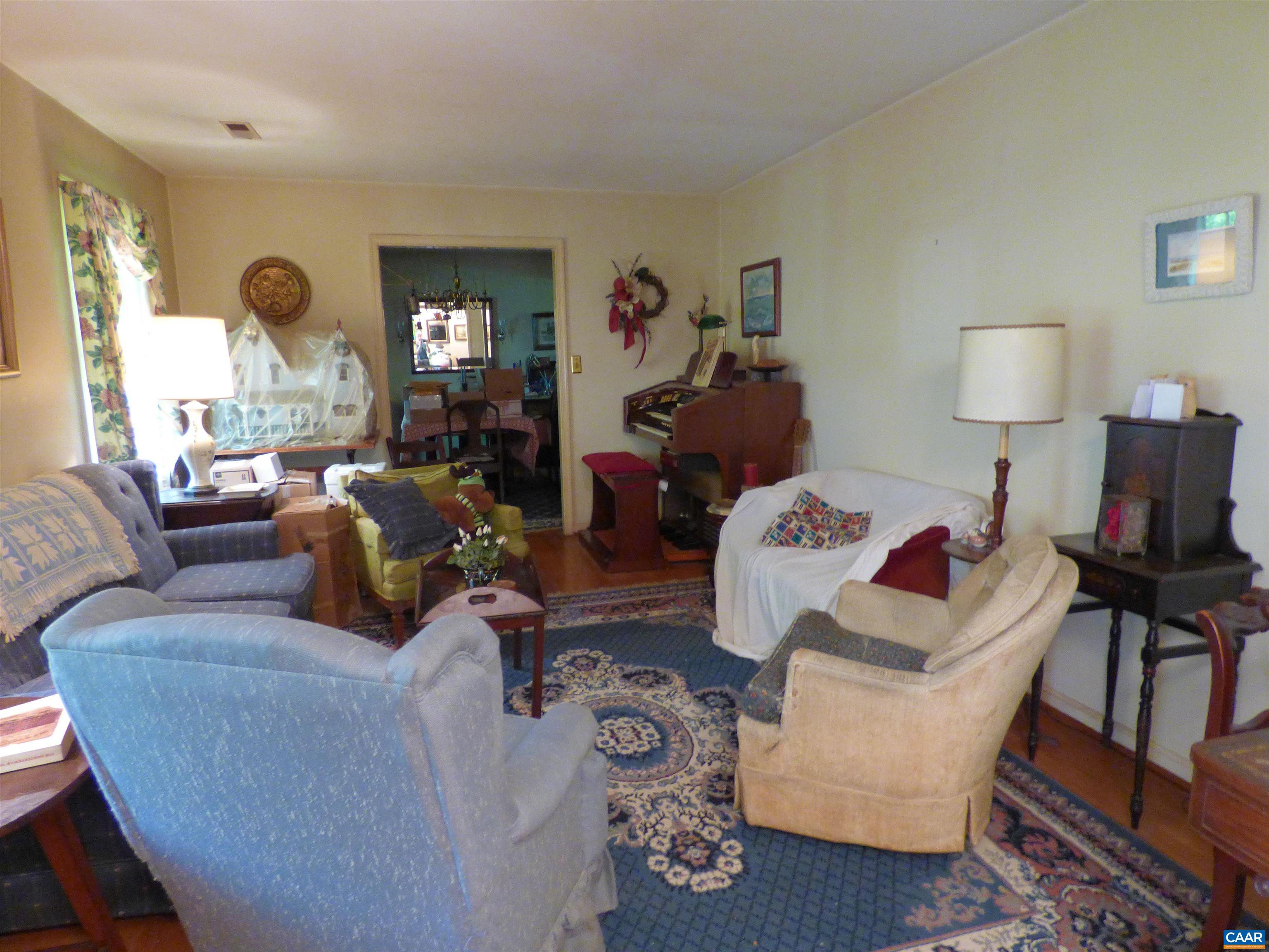 282 Kenmore Road Amherst, VA 24521 - Photo 6 of 33 a living room with furniture and a wooden floor