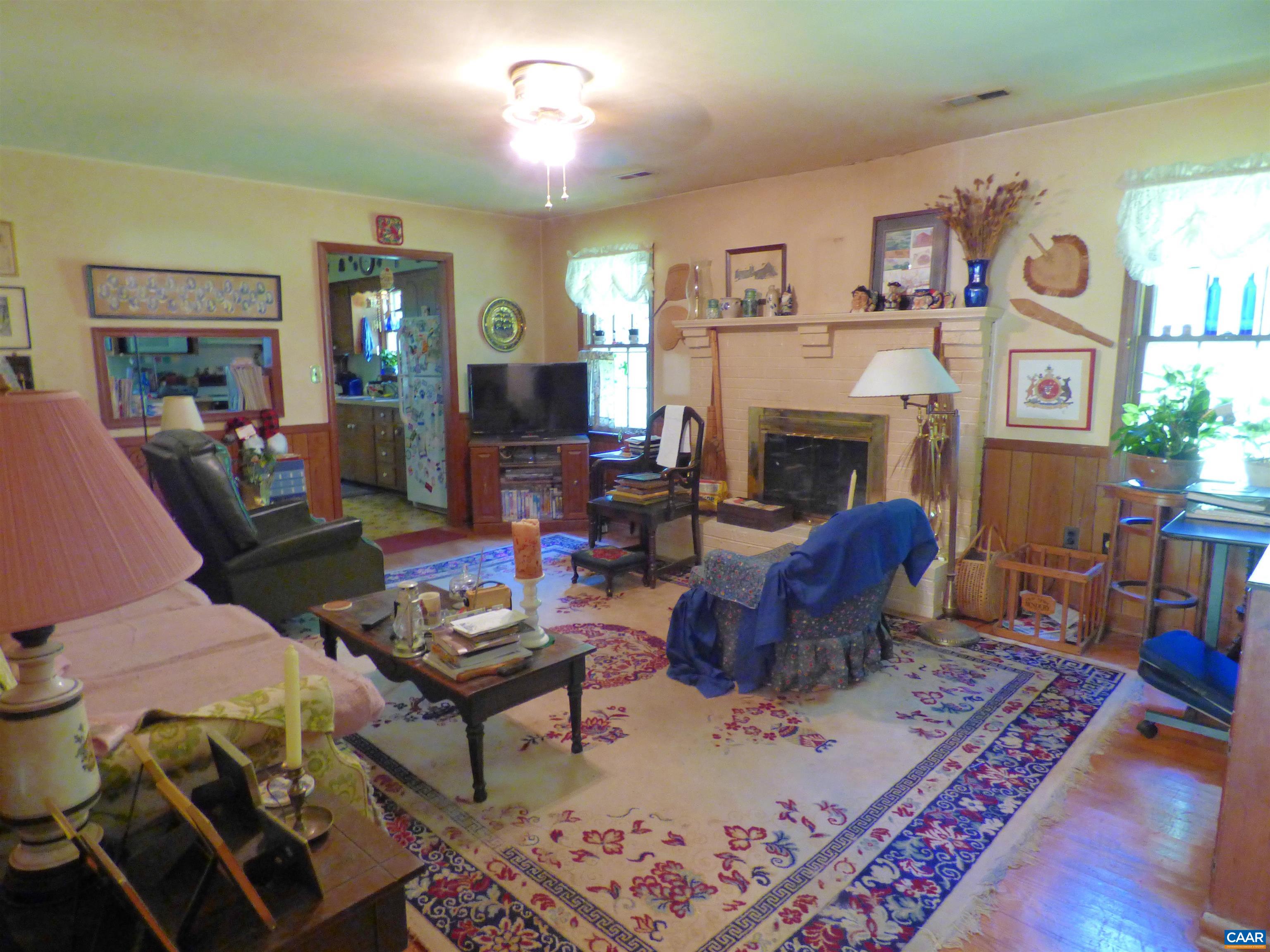 282 Kenmore Road Amherst, VA 24521 - Photo 7 of 33 a living room with furniture and a fireplace