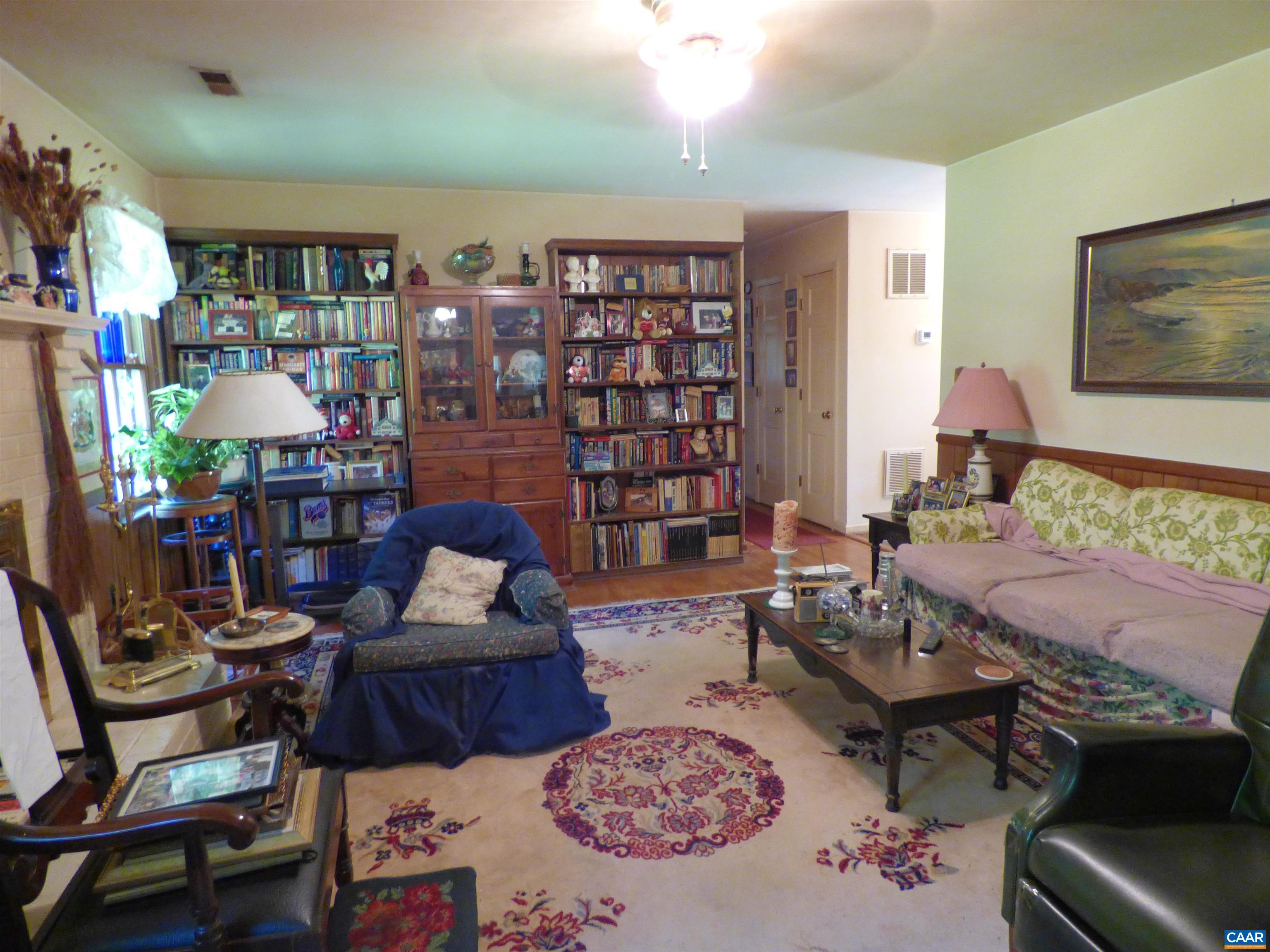 282 Kenmore Road Amherst, VA 24521 - Photo 10 of 33 a living room filled with furniture and a potted plant