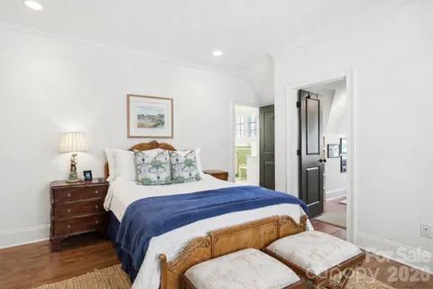 a bedroom with a bed and a lamp on table
