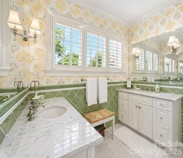 a bathroom with a granite countertop sink and a bathtub