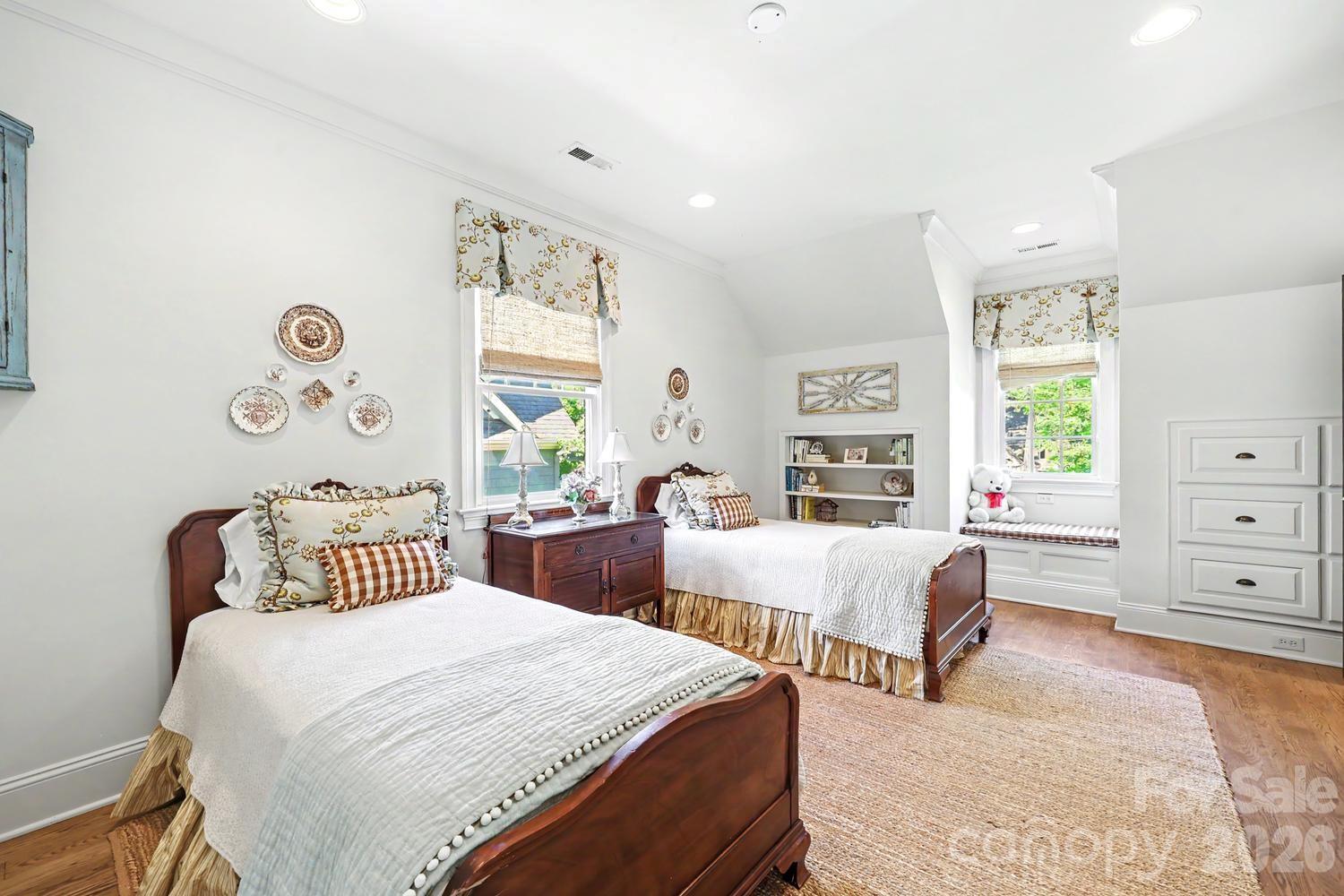 2744 Normandy Road Charlotte, NC 28209 - Photo 25 of 34 a bedroom with two beds and a window