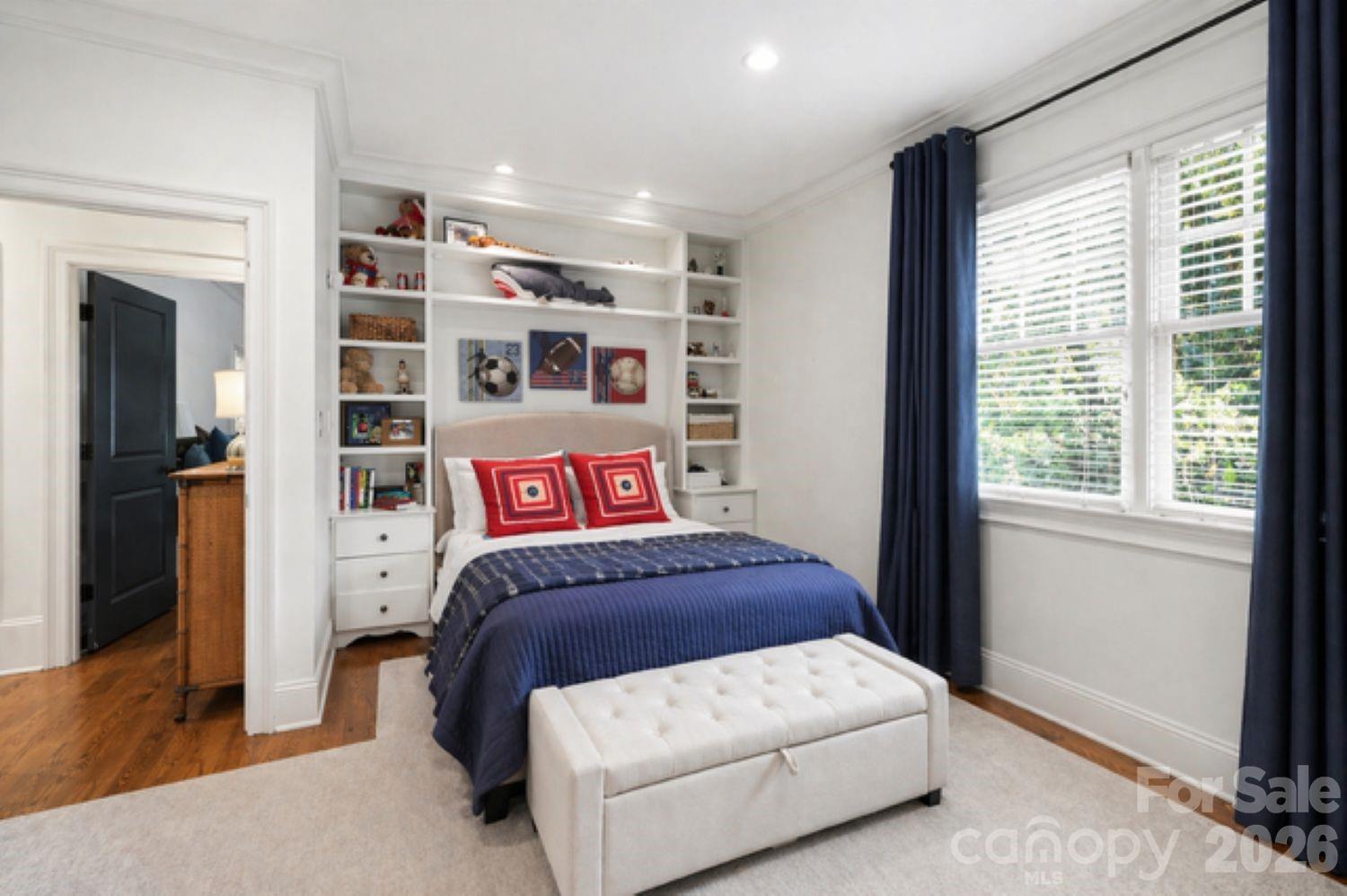 2744 Normandy Road Charlotte, NC 28209 - Photo 26 of 34 a bedroom with a large bed and a window