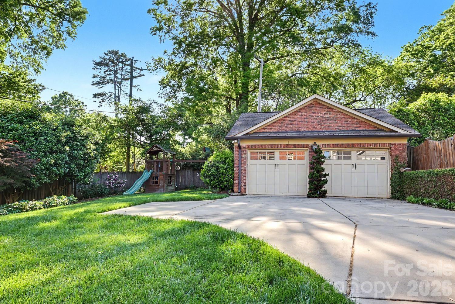 2744 Normandy Road Charlotte, NC 28209 - Photo 33 of 34 a front view of a house with a yard and garage