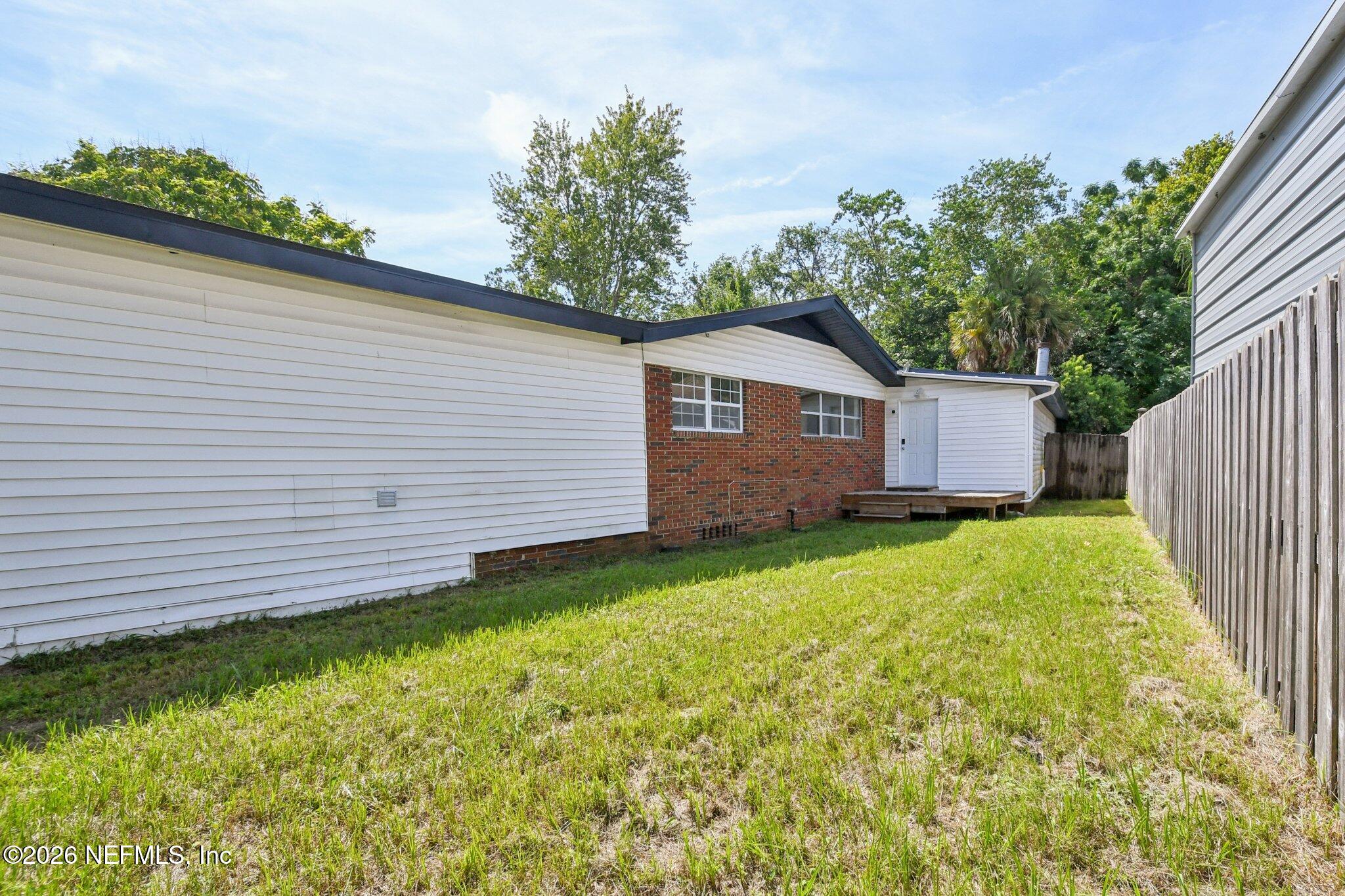 4079 Conga Street Jacksonville, FL 32217 - Photo 5 of 7 a view of a backyard with a garden