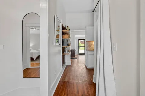 a bedroom with a bed and a painting