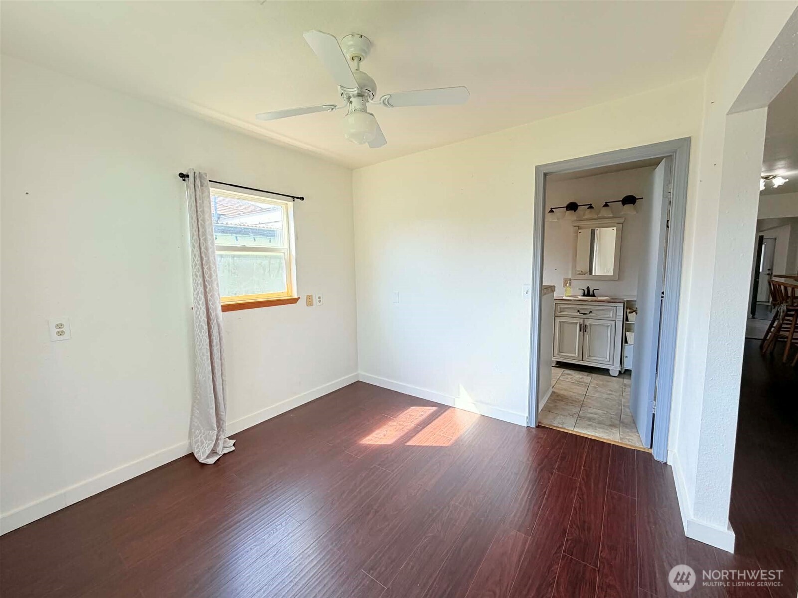 2006 West Second Street Aberdeen, WA 98520 - Photo 24 of 39 an empty room with wooden floor and a bathroom
