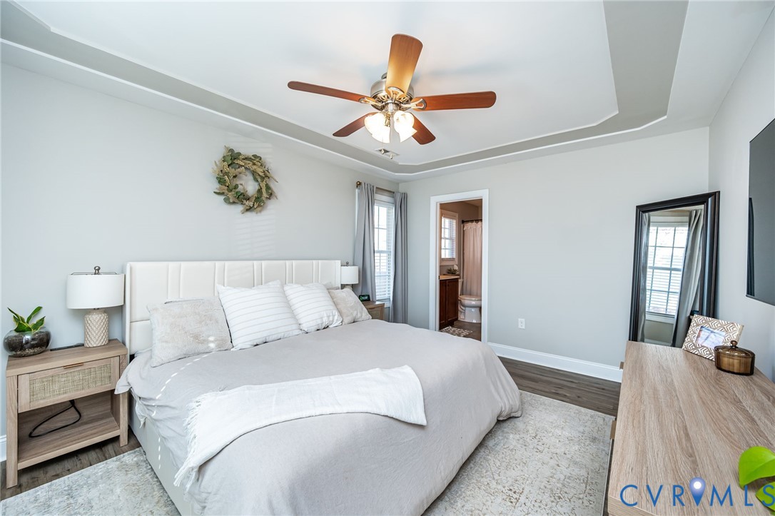 108 St Charles Place Aylett, VA 23009 - Photo 18 of 22 Bedroom featuring a raised ceiling, wood finished