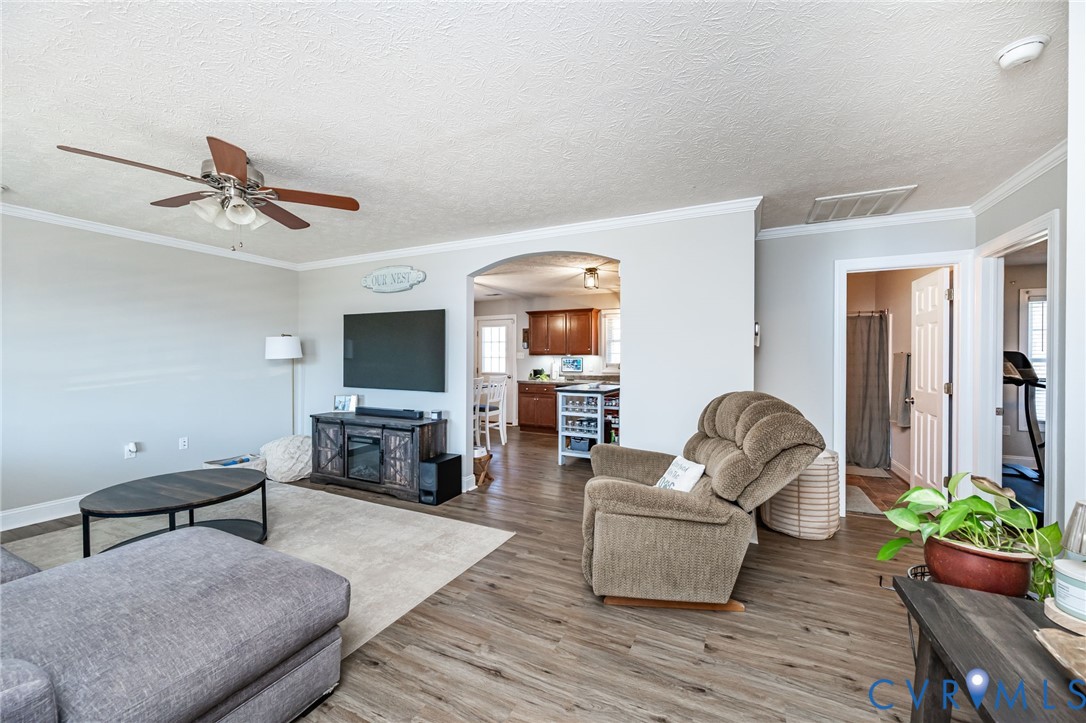108 St Charles Place Aylett, VA 23009 - Photo 4 of 22 Living area with a ceiling fan, arched walkways, a