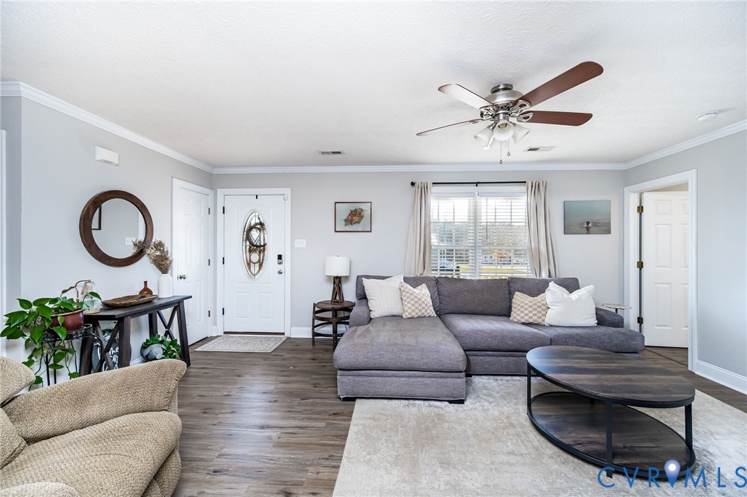 108 St Charles Place Aylett, VA 23009 - Photo 5 of 22 Living room with crown molding, a ceiling fan, and