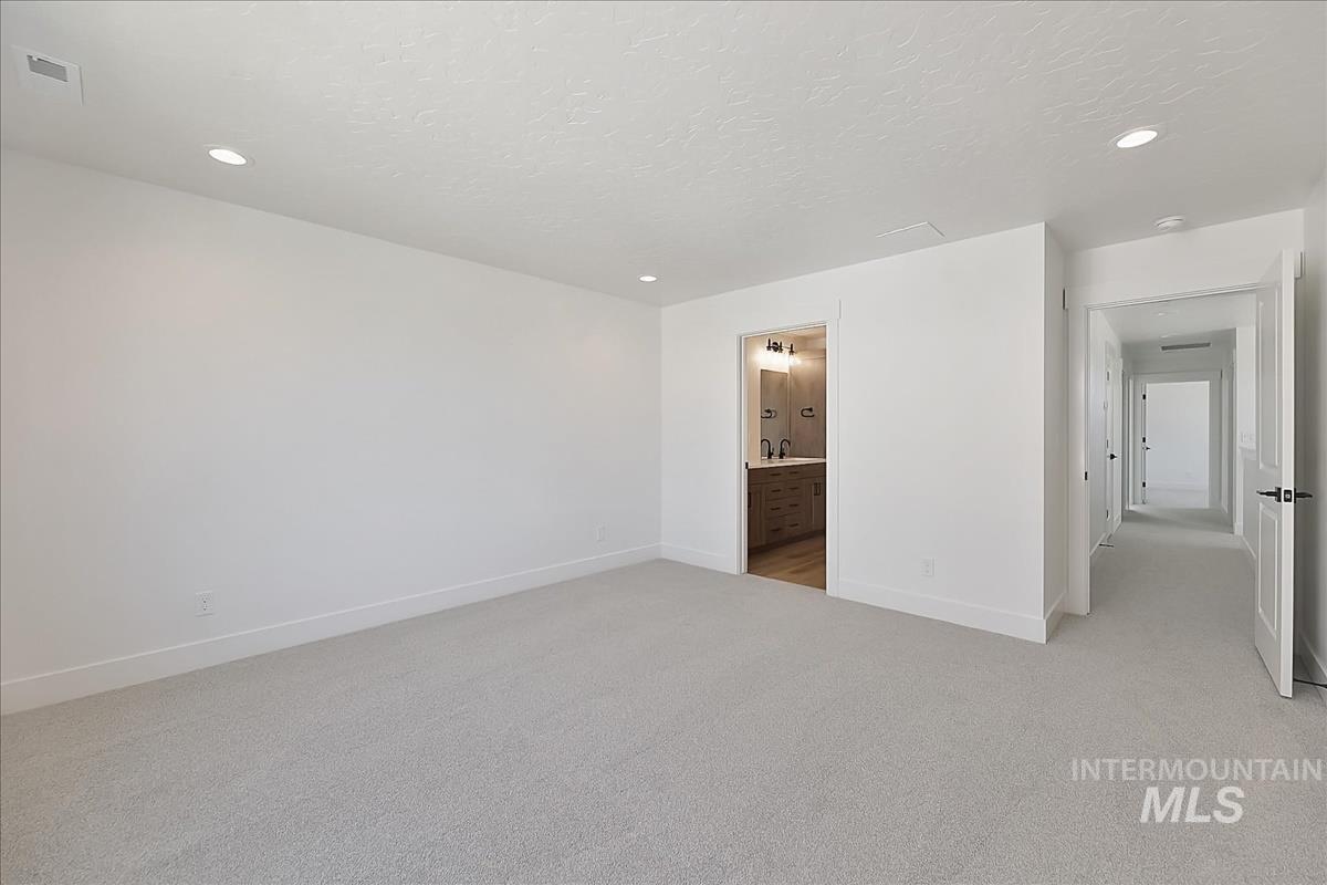 776 South Calhoun Lane Star, ID 83669 - Photo 24 of 49 Spacious room with plush gray carpeting and recessed lighting