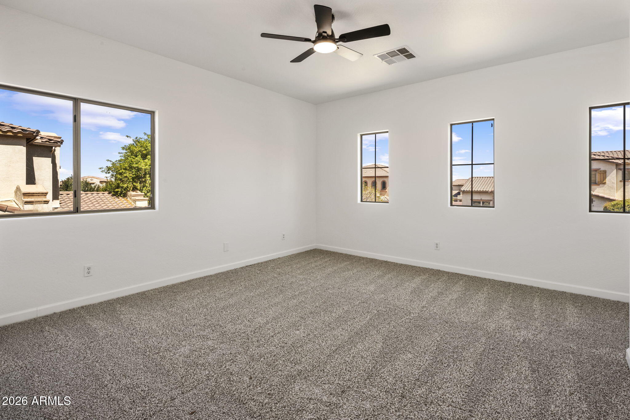 5121 West Beverly Road Laveen, AZ 85339 - Photo 27 of 32 wooden floor in an empty room with a window