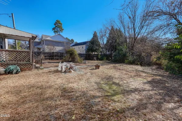 a view of a backyard with a large tree