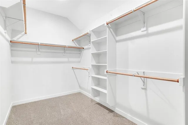 a view of an empty walk in closet