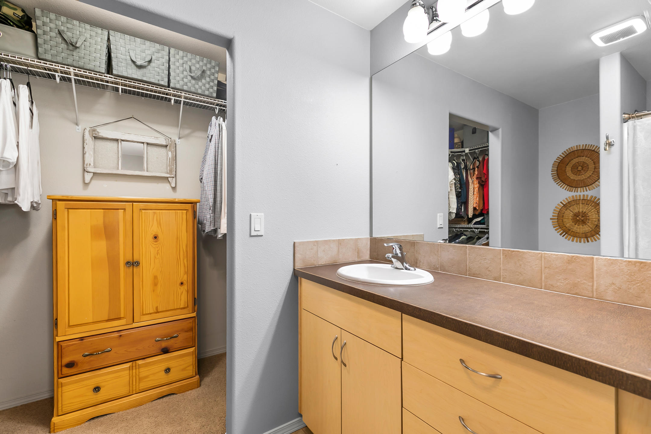 21363 Pecoraro Loop Bend, OR 97701 - Photo 11 of 15 a bathroom with a granite countertop sink and a mirror