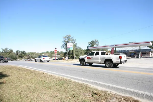 a view of street with parked cars