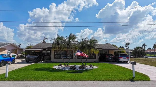 a picture of a table and chairs in the garden